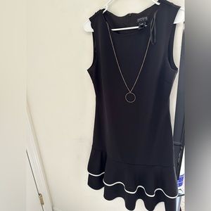 Black dress with white accent like at bottom with ruffle